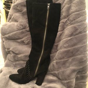 Zip up boots to below the knee. Made in Italy